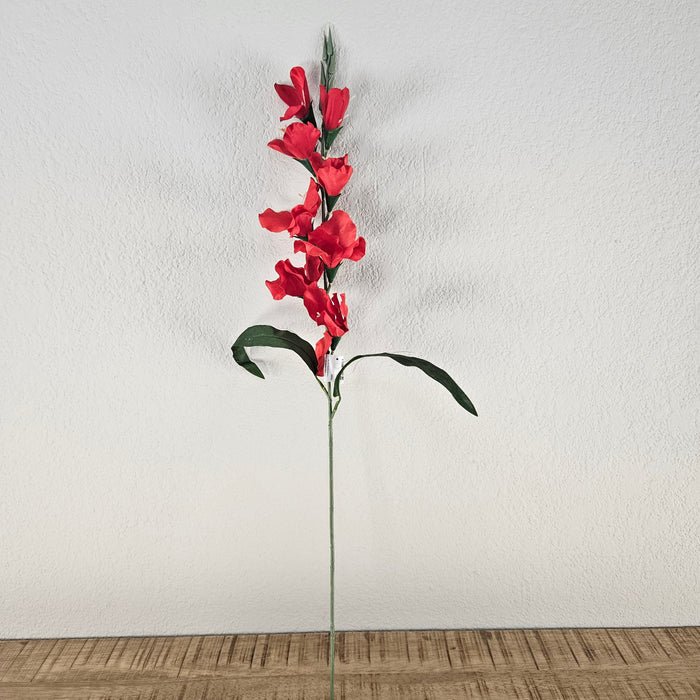 Artificial branch of red gladiolus